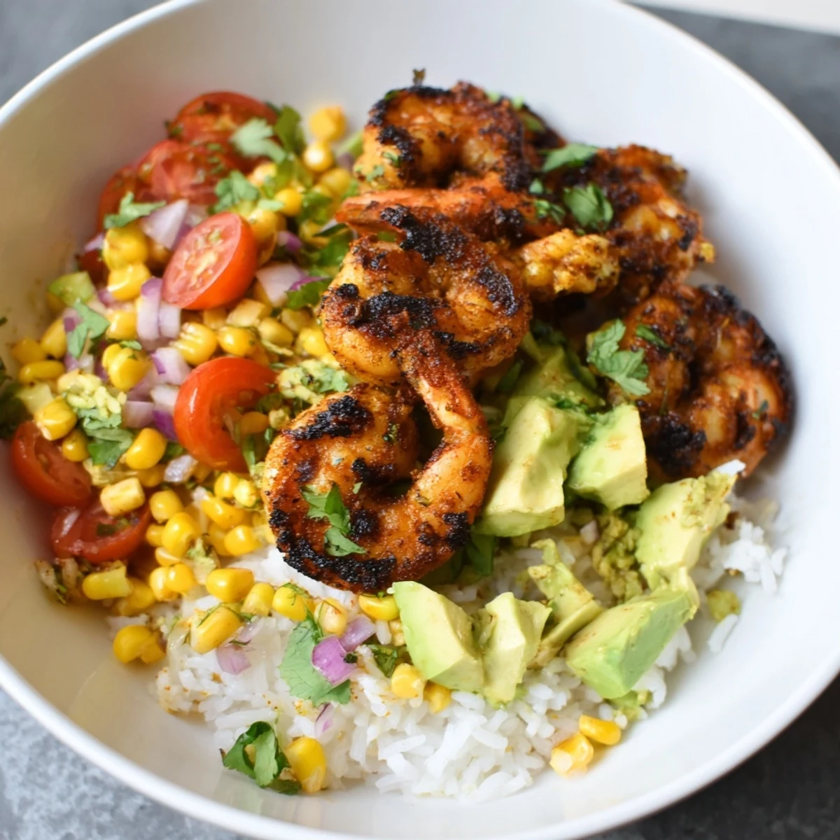 Vibrant image of Easy Grilled Shrimp Bowl with creamy avocado salsa, perfect for a light, delicious summer meal.