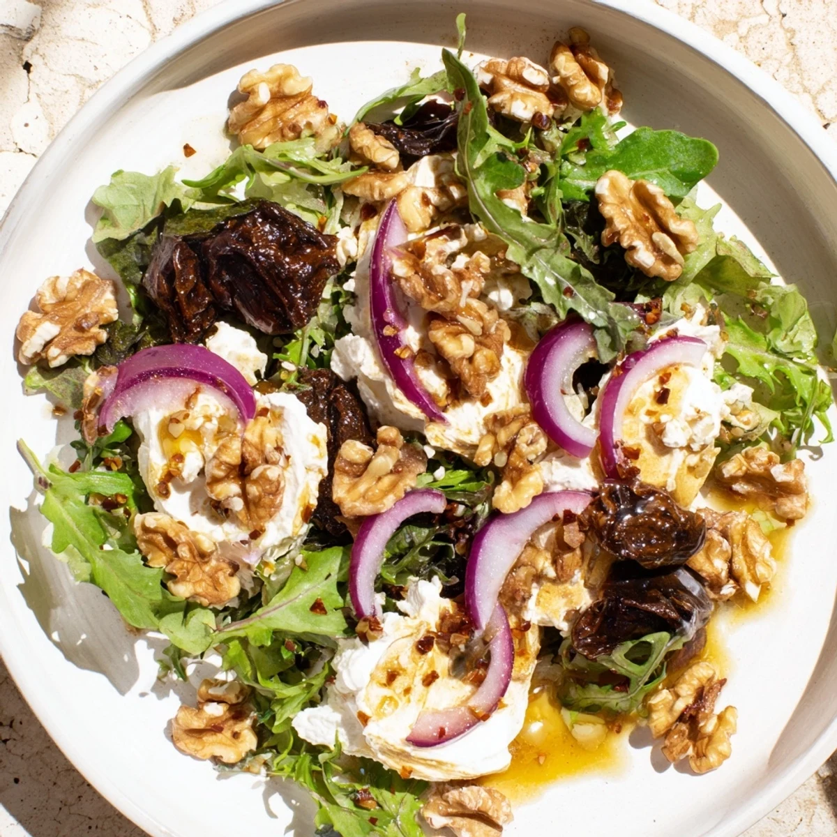 The delicious Spiced Honey and Date Goat Cheese Salad, a perfect blend of sweet dates & spiced honey.