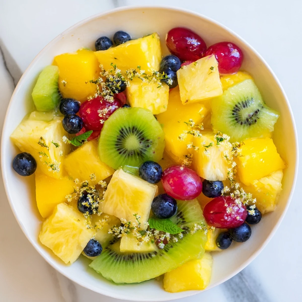 Magnificent Three Kings Royal Fruit Platter with glistening honey-lime dressing and colorful, fresh fruit.
