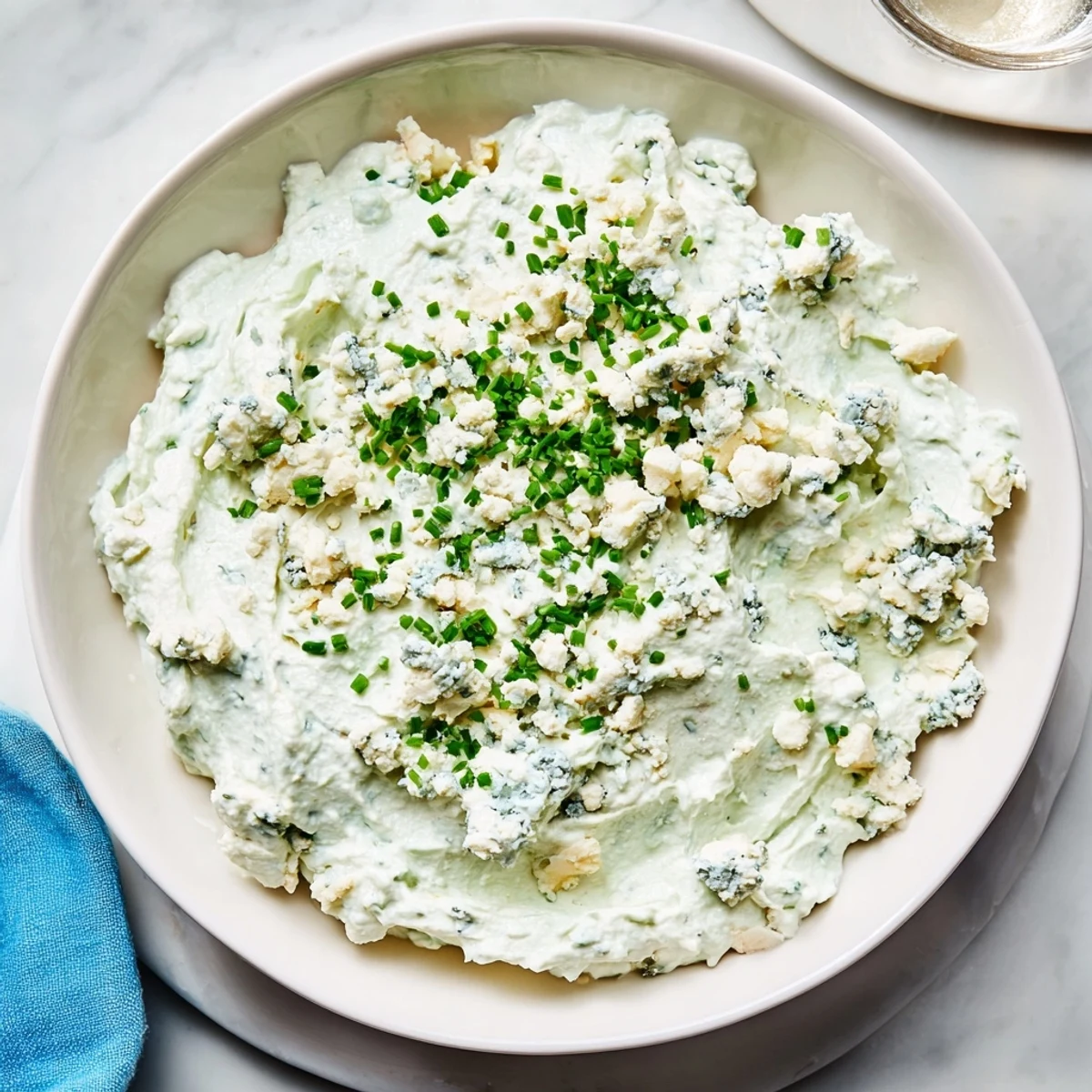 Creamy, vibrant Frozen Pond Blue Dip Platter, perfect for parties, with colorful chips and vegetables.