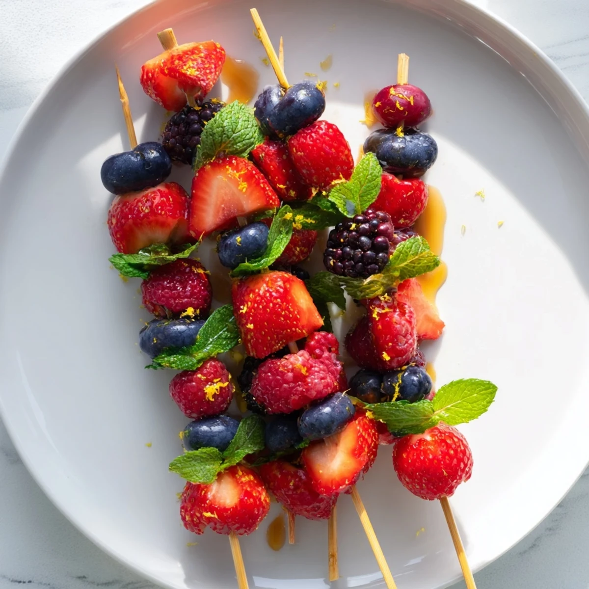Juicy, bright fruit skewers with fresh berries and fragrant mint, easy and healthy.