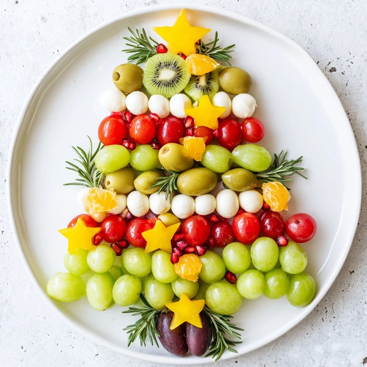 Close-up of a Christmas Tree Triangle Board appetizer, filled with colorful fruits and festive toppings.