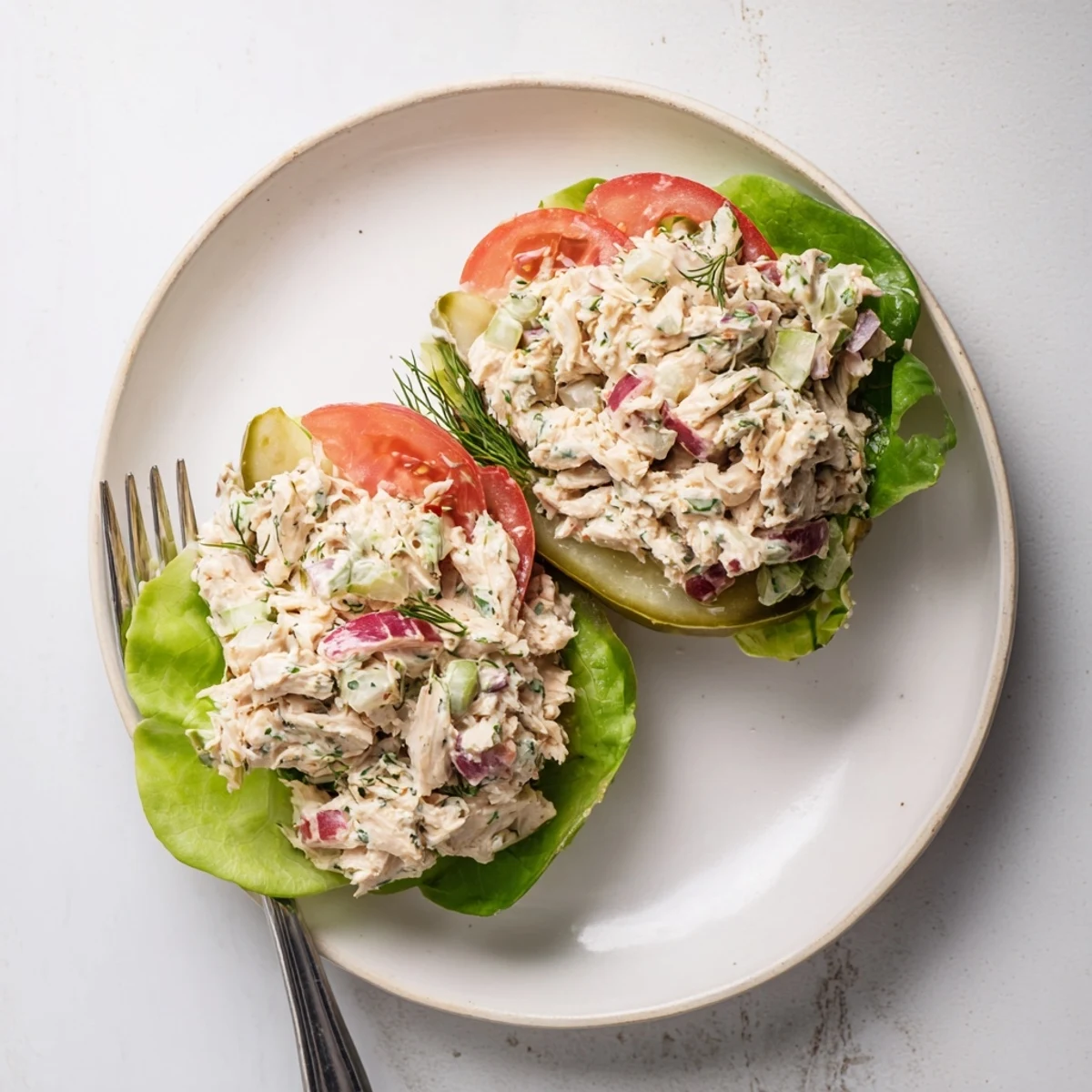 Crisp, juicy chicken salad nestled in cool pickle boats, making a refreshing Pickle Sandwich.
