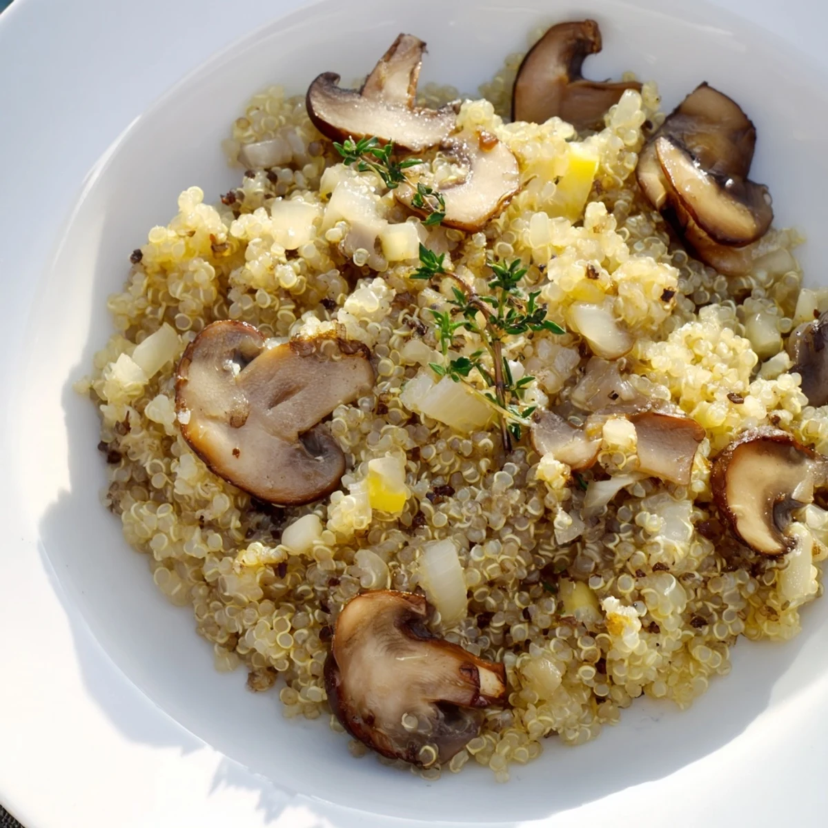 Earthy mushrooms and fluffy quinoa combine in this delicious Mushroom Quinoa Risotto, perfect for dinner.