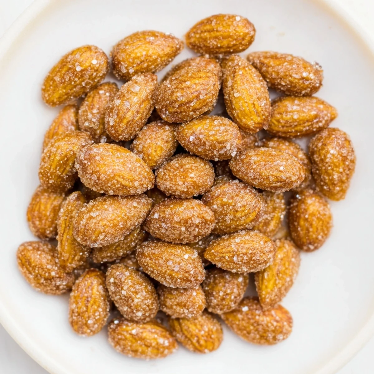 Enjoy these aromatic cinnamon roasted almonds as a simple, crunchy treat, coated in sweet spices.