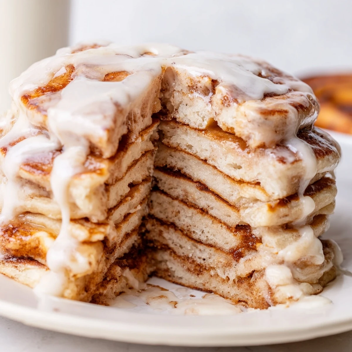 Indulge in these homemade Cinnamon Roll Pancakes: buttery, fluffy, and perfectly topped with glaze.