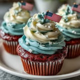 Delightful Star-Spangled Banner Cupcakes, boasting vibrant frosting and festive American flag decorations.