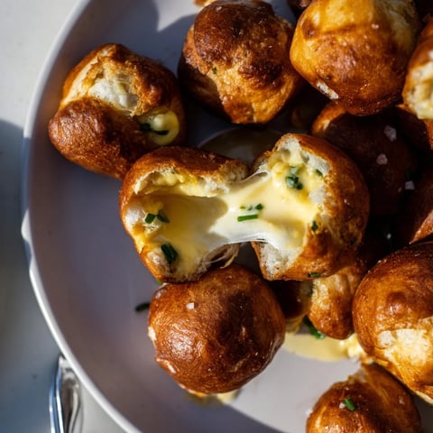Soft jalapeño popper stuffed pretzel bites, warm and cheesy, perfect for gatherings.  