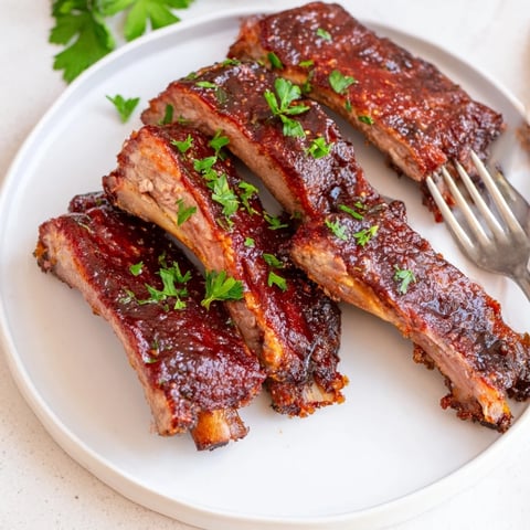 Tender classic BBQ ribs with dry rub, perfectly charred and ready to savor.  