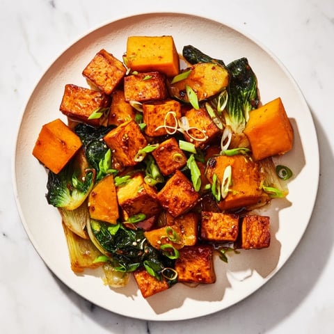 Golden brown Miso-Glazed Tofu alongside tender winter squash and bok choy, ready to serve.