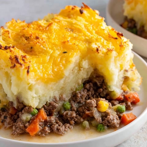 Golden, bubbly Budget Shepherds Pie with mashed potato topping, a hearty family-favorite meal.