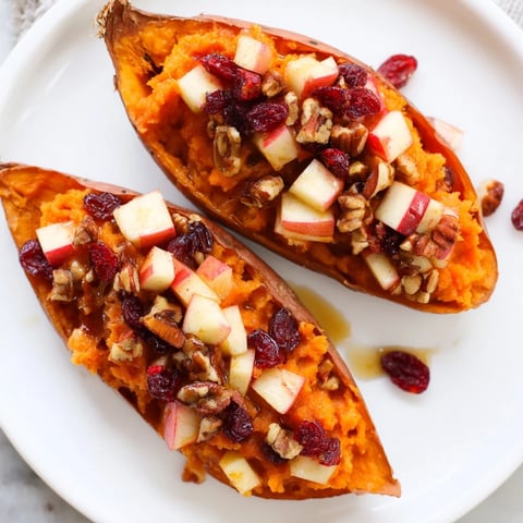 Golden and glistening Cranberry Apple Twice-Baked Sweet Potatoes, an inviting fall side dish.