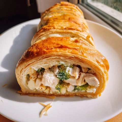 Golden, flaky Creamy Chicken and Broccoli Puff Pastry Rolls, freshly baked with a creamy filling, ready to serve.