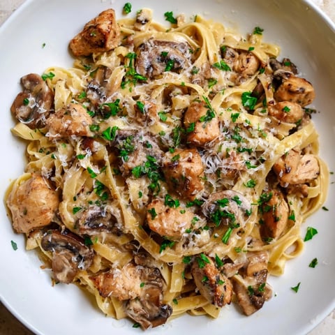Golden chicken and mushrooms blanketed in creamy sauce over Creamy Mushroom Chicken Pasta.