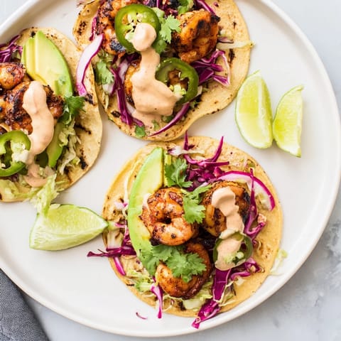 Flavorful chipotle grilled shrimp tacos served in warm tortillas with zesty lime.  