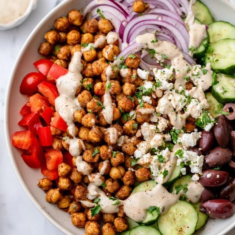 A close-up of a delicious Mediterranean Chickpea Bowl, showcasing perfectly spiced chickpeas and vibrant vegetables.
