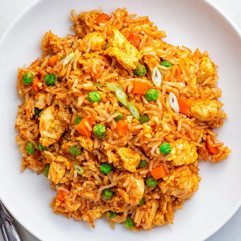 This easy 30-minute butter chicken fried rice combines tender chicken, aromatic spices, and stir-fried vegetables for a comforting dinner.