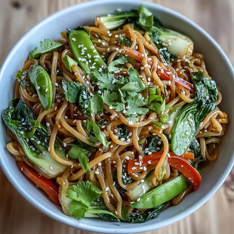 Top-down view of a warm, vegan Shirataki Noodle Bowl garnished with fresh green onions.