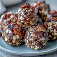 Close-up of wholesome energy balls made with oats and chocolate chips, ideal for soccer game snacks.