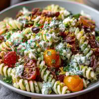 Easy Taco Pasta Salad with colorful vegetables and creamy taco dressing, perfect for summer potlucks and casual gatherings.  