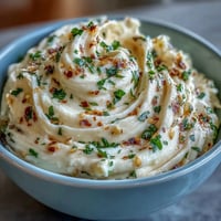 Creamy garlic aioli homemade mayonnaise with fresh garlic and lemon, perfect for dipping fries or spreading on sandwiches.